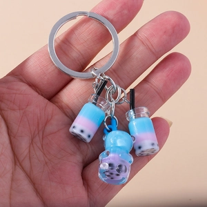 Fashionable bubble tea keychain featuring gradient liquid cups and a cute cartoon bear charm