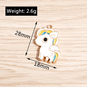 Detail view of cartoon unicorn charm with dimensions 28mm by 18mm and gold metal trim