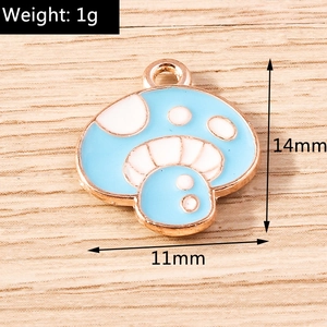 Macro shot of light blue mushroom pendant with gold metal trim on wood background