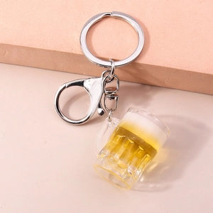 Detailed top view of a resin beer mug keychain with realistic foam and silver lobster clasp