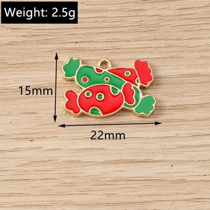 Detail view of red and green candy pendant charms showing 22mm size and weight specs
