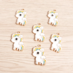 Golden unicorn charms set with white enamel inlay for DIY earrings and jewelry making