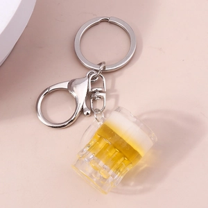 Creative resin beer mug keychain with realistic foam detail on pink background
