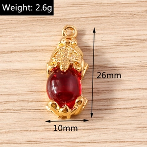 Detailed view of a gold-plated Pixiu pendant with red gemstone and 26mm size marking