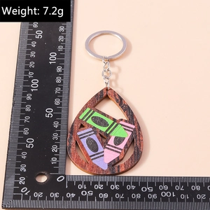 Measurement of teardrop wooden keychain with colorful crayon patterns and metal ring