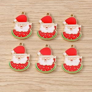Flat lay of six Santa Claus holding watermelon alloy pendants for DIY jewelry making