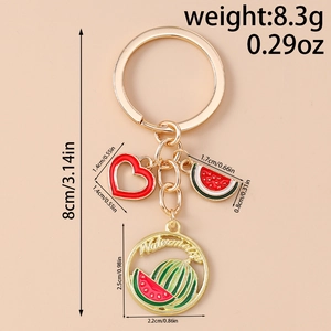 Detail showing red enamel heart and watermelon charm with product weight and size labels