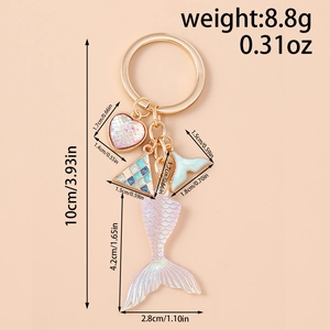 Detail showing mermaid tail keychain dimensions with iridescent resin and metal charms