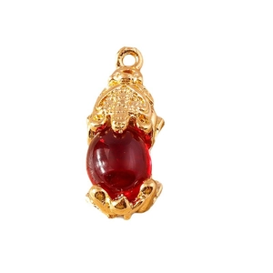 Golden PiXiu mythical beast pendant with a large translucent red bead and closed top loop