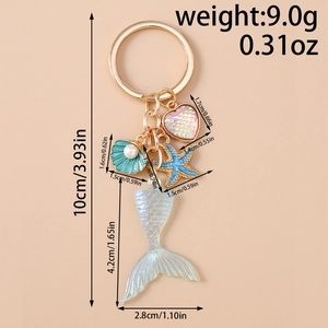 Detailed view of mermaid tail keychain with dimensions of charms and weight specifications