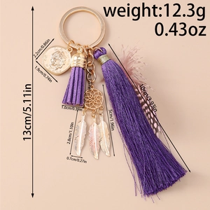 Detailed view of bohemian dreamcatcher keychain with purple tassels and size measurements