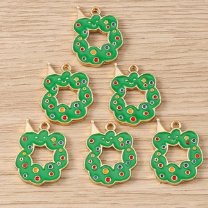Detail of DIY Christmas wreath charms made of green alloy and colorful enamel dots