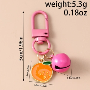 Detailed view of cartoon orange keychain with pink bell and precise size measurements