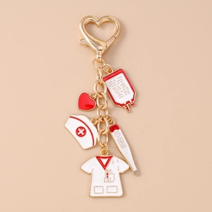 Detailed nurse keychain with medical charms like syringe and heart in gold finish