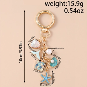 Detailed view of ocean-themed keychain showing dimensions and diverse nautical charms