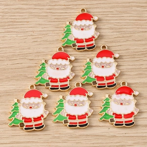 Detail of Christmas Santa and tree alloy charms with colorful enamel finish for DIY jewelry