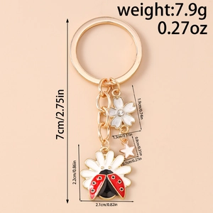 Detailed size chart for floral ladybug keychain with weights and measurements in cm and inch