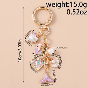 Detail of keychain with mermaid, colorful heart, pearl, and fishtail pendants