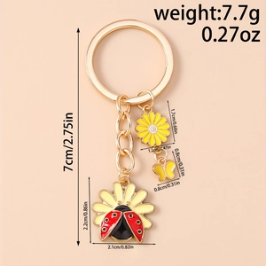 Detailed view of floral keychain dimensions with daisy, ladybug and butterfly charms
