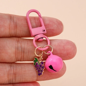 Fashionable pink grape keychain with metal bell and D-hook for bags and accessories