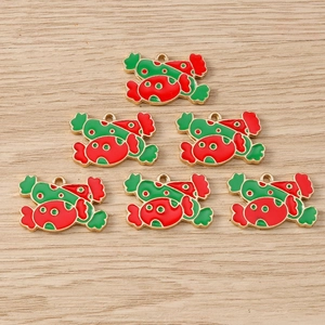 Detailed close-up of candy-shaped enamel charms with festive red and green Christmas colors