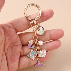 Fashion gold keychain with mermaid tail, colorful shell, and pearl charms for women