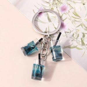 Detailansicht der Mini Bubble Tea Schlüsselanhänger mit blauem Glitzer und Silberring