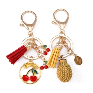 Lot de porte-clés tendance avec breloques cerise et durian et pompons colorés