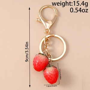 Detailed view of artificial strawberry keychain with precise size and weight measurements