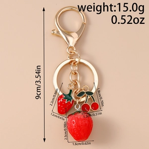 Detailed view of 3D strawberry keychain with measurements and gold alloy hardware