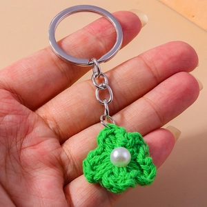 Handmade knitted green clover flower keychain with pearl detail and silver ring