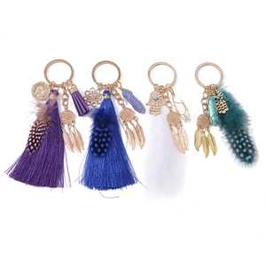 Bohemian dreamcatcher keychains with tassels, feathers, and crystal hexagon pillars