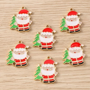 Close-up of Santa Claus and Christmas tree alloy pendants for DIY jewelry making