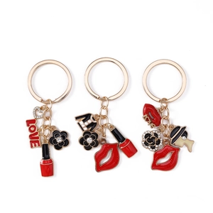 Creative women's keychain set with lipstick, rose, and love charms in red and black enamel