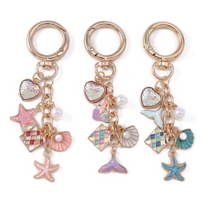 Ocean theme keychain set with starfish, mermaid tail and seashell pendants in three colors