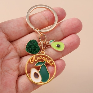 Portachiavi avocado dorato con cuore glitterato e ciondolo rotondo per decorare borse