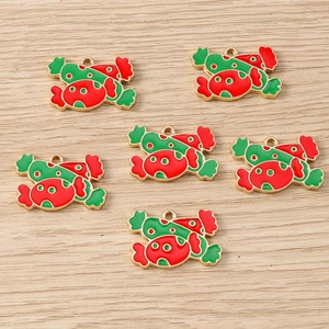 Detail of candy-shaped Christmas charms with red and green enamel and gold plating