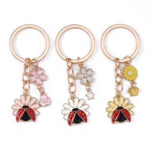 Pastoral flower and ladybug enamel keychains with daisies and crystals for bag decor