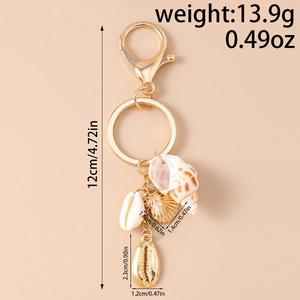 Détails du porte-clés coquillage marin avec conque naturelle et pendentifs dorés