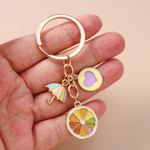 Fashion fruit keychain with rainbow umbrella and purple heart charm on golden ring