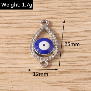 Detail showing evil eye charm dimensions 25mm by 12mm with rhinestone border