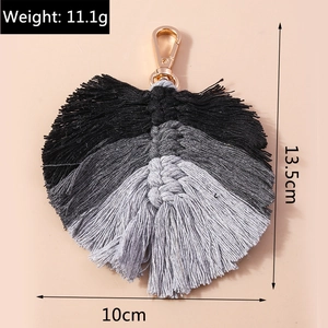 Detail showing dimensions and weight of this handmade tri-color woven leaf keychain pendant
