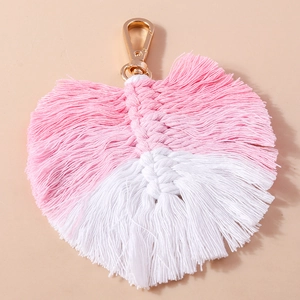 Handmade macrame banana leaf keychain with pink and white gradient and gold lobster clasp
