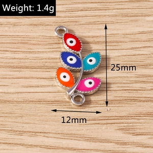Detail of colorful leaf evil eye charm with dimensions 25x12mm and 1.4g weight