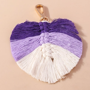 Detail of handmade macramé leaf keychain with purple gradient and gold lobster clasp