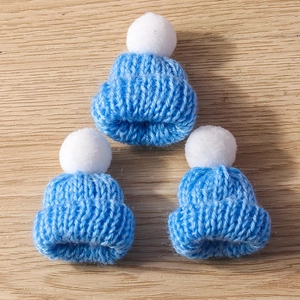 Three blue mini knitted Christmas hat charms with white pom-poms for DIY jewelry crafts