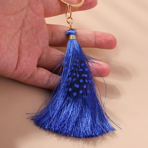 Bohemian feather keychain with deep blue tassels and golden ring for bag charm