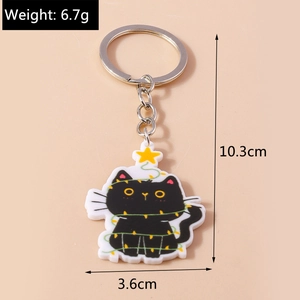 Détail d'un porte-clés chat avec breloque étoile et dimensions de 10,3 cm