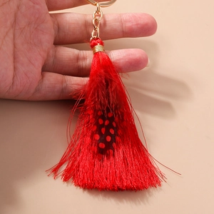 Elegant Bohemian red tassel keychain with natural polka dot feather and golden ring