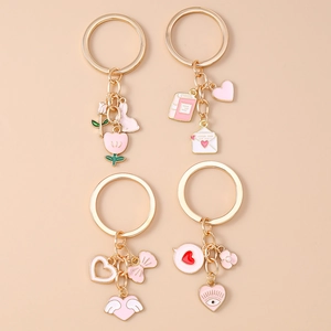 Fashionable rabbit and tulip keychain set with pink enamel heart and bow charms